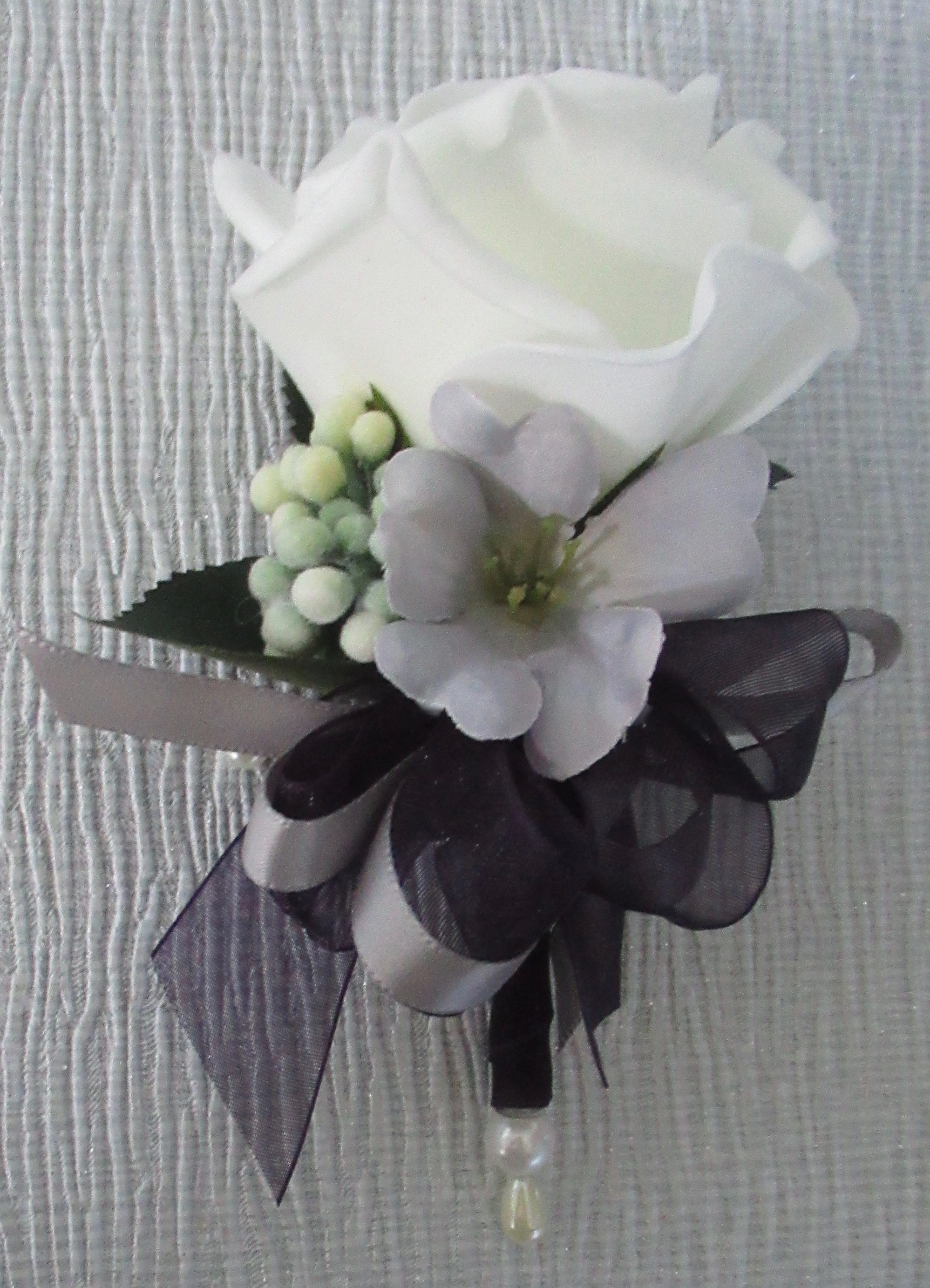 aubergine and silver corsage